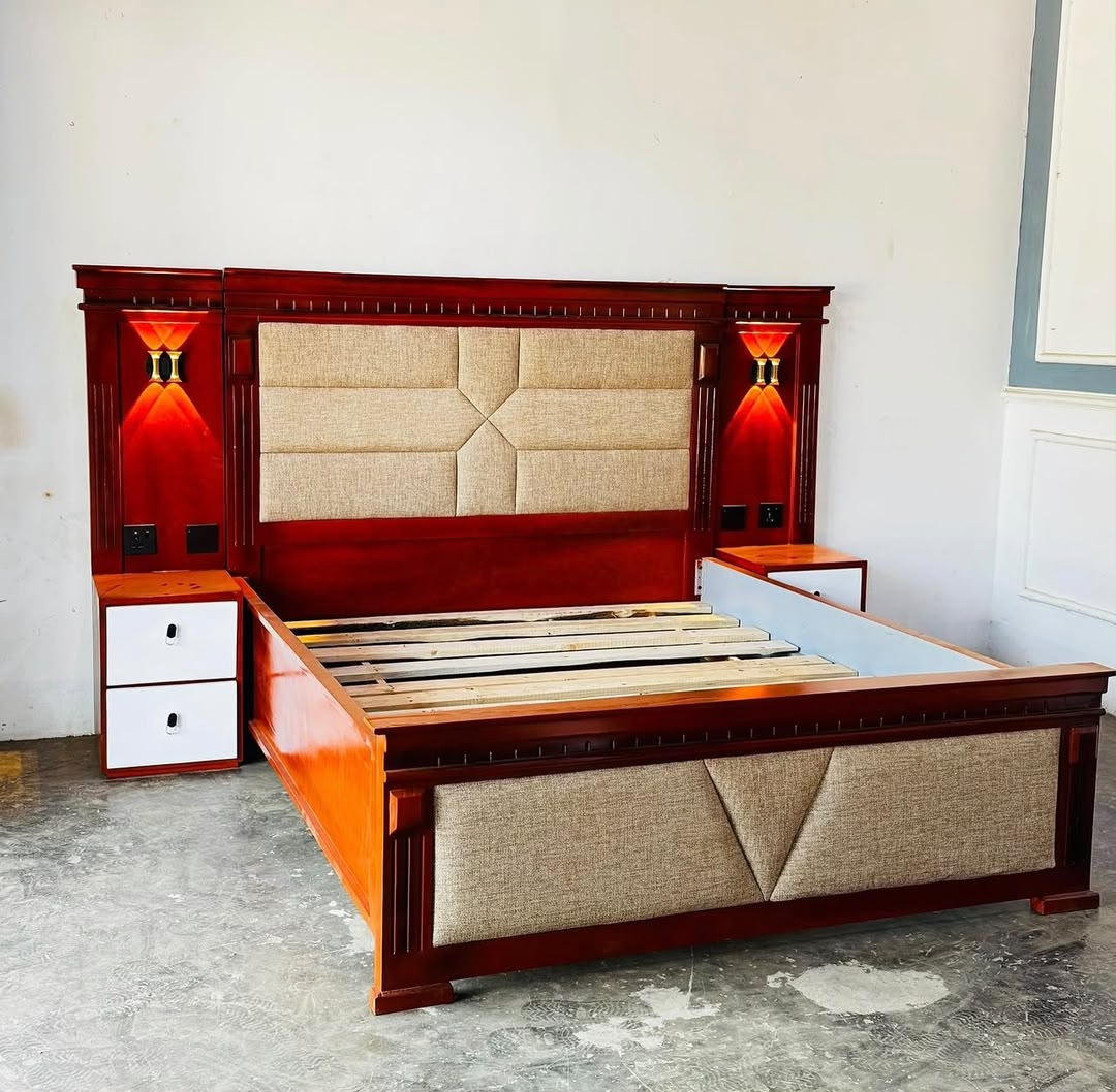 Mahogany bed with lit headboard and bedside units