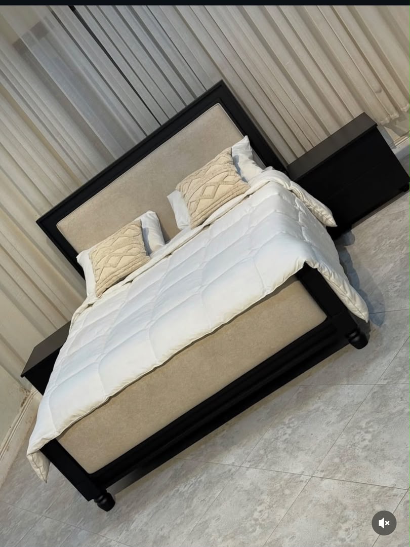 Upholstered bed with matching bedside tables