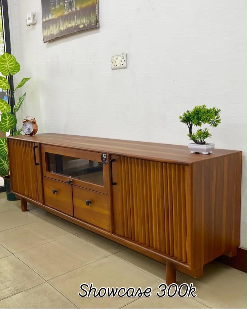 Teak showcase unit with fluted sliding doors
